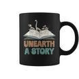 Unearth A Story Skeleton Dinosaur Book Summer Reading 2026 Graphic Print Coffee Mug Unearth A Story Skeleton Dinosaur Book Summer Reading 2026 Graphic Print Coffee Mug