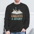 Unearth A Story Skeleton Dinosaur Book Summer Reading 2026 Sweatshirt Gifts for Old Men Unearth A Story Skeleton Dinosaur Book Summer Reading 2026 Sweatshirt Gifts for Old Men
