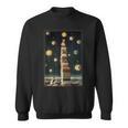 Astrologist Sitting On The Tower Of Stacked Up Books Starry Sweatshirt