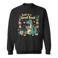 Lost In a Good Book Cute Reading Dinosaur Illustration Sweatshirt Lost In a Good Book Cute Reading Dinosaur Illustration Sweatshirt