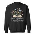 A New Chapter Begins Retired 2026 Floral Book Retirement Sweatshirt A New Chapter Begins Retired 2026 Floral Book Retirement Sweatshirt