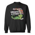Summer Reading 2026 Unearth a Story Theme Dinosaur Book Nerd Sweatshirt Summer Reading 2026 Unearth a Story Theme Dinosaur Book Nerd Sweatshirt
