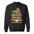 Unearth a Story Dinosaur Reading Books Summer 2026 Sweatshirt Unearth a Story Dinosaur Reading Books Summer 2026 Sweatshirt