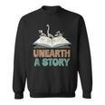 Unearth A Story Skeleton Dinosaur Book Summer Reading 2026 Sweatshirt Unearth A Story Skeleton Dinosaur Book Summer Reading 2026 Sweatshirt