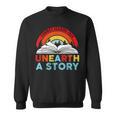 Unearth a Story Summer Reading 2026 Vintage Book Rainbow Sweatshirt Unearth a Story Summer Reading 2026 Vintage Book Rainbow Sweatshirt