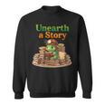 Women's Unearth a Story Summer 2026 Dinosaur Reading Books Dino Sweatshirt
