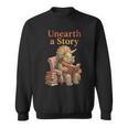Women's Unearth a Story Triceratops Dinosaur Reading Books Dino Sweatshirt