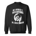 In A World Of Bookworms Be A Book Dragon Inspirational Sweatshirt
