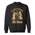 In A World Of Bookworms Be A Book Dragon Sweatshirt