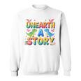 Summer Reading Unearth A Story Dinosaur Books 2026 Sweatshirt Summer Reading Unearth A Story Dinosaur Books 2026 Sweatshirt