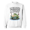 Unearth a Story Frog Reading a Book Summer 2026 Premium Tri-Blend Sweatshirt Unearth a Story Frog Reading a Book Summer 2026 Premium Tri-Blend Sweatshirt