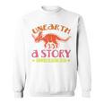 Unearth a Story Summer Reading 2026 Triceratops Dino Book Premium Tri-Blend Sweatshirt Unearth a Story Summer Reading 2026 Triceratops Dino Book Premium Tri-Blend Sweatshirt