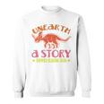 Unearth a Story Summer Reading 2026 Triceratops Dino Book Sweatshirt