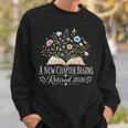 A New Chapter Begins Retired 2026 Floral Book Retirement Sweatshirt Gifts for Him A New Chapter Begins Retired 2026 Floral Book Retirement Sweatshirt Gifts for Him
