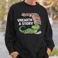 Summer Reading 2026 Unearth a Story Theme Dinosaur Book Nerd Sweatshirt Gifts for Him Summer Reading 2026 Unearth a Story Theme Dinosaur Book Nerd Sweatshirt Gifts for Him