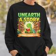 Unearth A Story Dinosaur Summer Reading 2026 Books Sweatshirt Gifts for Him Unearth A Story Dinosaur Summer Reading 2026 Books Sweatshirt Gifts for Him