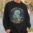 Unearth A Story Summer Reading 2026 Cute Dinosaur Reading Sweatshirt Gifts for Him Unearth A Story Summer Reading 2026 Cute Dinosaur Reading Sweatshirt Gifts for Him