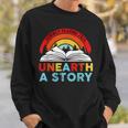 Unearth a Story Summer Reading 2026 Vintage Book Rainbow Sweatshirt Gifts for Him Unearth a Story Summer Reading 2026 Vintage Book Rainbow Sweatshirt Gifts for Him