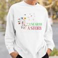 Unearth a Story Summer Reading 2026 Dandelion Books Readers Premium Tri-Blend Sweatshirt Gifts for Him