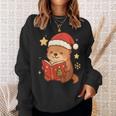 Cute Christmas Book Otter Reading Snowy Holiday Story Sweatshirt Gifts for Her