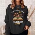 A New Chapter Begins Retired 2026 Floral Book Butterfly Tee Sweatshirt Gifts for Her