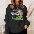 Summer Reading 2026 Unearth a Story Theme Dinosaur Book Nerd Sweatshirt Gifts for Her Summer Reading 2026 Unearth a Story Theme Dinosaur Book Nerd Sweatshirt Gifts for Her