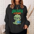 Women's Unearth a Story Summer Reading 2026 Triceratops Dino Book Sweatshirt Gifts for Her