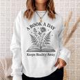 A Book A Day Keeps Reality Away Floral Reader Sweatshirt Gifts for Her