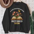 A New Chapter Begins Retired 2026 Floral Book Butterfly Tee Sweatshirt Gifts for Old Women