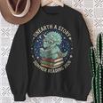 Unearth A Story Summer Reading 2026 Cute Dinosaur Reading Sweatshirt Gifts for Old Women Unearth A Story Summer Reading 2026 Cute Dinosaur Reading Sweatshirt Gifts for Old Women