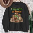 Women's Unearth a Story Summer 2026 Dinosaur Reading Books Dino Sweatshirt Gifts for Old Women