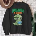 Women's Unearth a Story Summer Reading 2026 Triceratops Dino Book Sweatshirt Gifts for Old Women