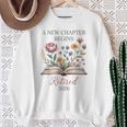Retired 2026 Teacher Women A New Chapter Begins Floral Book Sweatshirt Gifts for Old Women