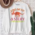Unearth a Story Summer Reading 2026 Triceratops Dino Book Premium Tri-Blend Sweatshirt Gifts for Old Women Unearth a Story Summer Reading 2026 Triceratops Dino Book Premium Tri-Blend Sweatshirt Gifts for Old Women