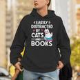 Easily Distracted By Cats And Books Cute Cat And Book Lovers Unisex Hoodie Easily Distracted By Cats And Books Cute Cat And Book Lovers Unisex Hoodie