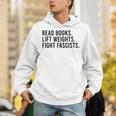 Read Books Lift Weights Fight Fascists Reading Activism Unisex Hoodie Read Books Lift Weights Fight Fascists Reading Activism Unisex Hoodie