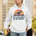 Unearth A Story Dinosaur Reader Book Lover 2026 Unisex Hoodie Unearth A Story Dinosaur Reader Book Lover 2026 Unisex Hoodie
