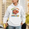 Unearth A Story Summer Reading 2026 Dinosaur Book Lover Dino Premium Tri-Blend Unisex Hoodie Unearth A Story Summer Reading 2026 Dinosaur Book Lover Dino Premium Tri-Blend Unisex Hoodie