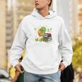 Unearth a Story Triceratops Dinosaur Reading Books Cute Dino Premium Tri-Blend Unisex Hoodie