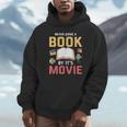 Never Judge A Book By It's Movie Reading Unisex Hoodie Never Judge A Book By It's Movie Reading Unisex Hoodie