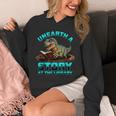 Unearth A Story At The Library Dinosaur Reading Unisex Hoodie Unearth A Story At The Library Dinosaur Reading Unisex Hoodie