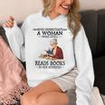 Never Underestimate A Woman Who Still Reads Books In Her Unisex Hoodie