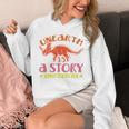 Unearth a Story Summer Reading 2026 Triceratops Dino Book Premium Tri-Blend Unisex Hoodie Unearth a Story Summer Reading 2026 Triceratops Dino Book Premium Tri-Blend Unisex Hoodie