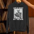Life Is Short Buy The Book Skeleton Reading Book Unisex Hoodie Life Is Short Buy The Book Skeleton Reading Book Unisex Hoodie