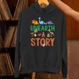 Summer Reading 2026 Dinosaurs Book Lover Unearth A Story Unisex Hoodie