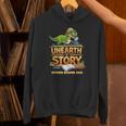 Unearth a Story Dinosaur Reading Books Summer 2026 Unisex Hoodie Unearth a Story Dinosaur Reading Books Summer 2026 Unisex Hoodie