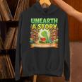 Unearth A Story Dinosaur Summer Reading 2026 Books Unisex Hoodie Unearth A Story Dinosaur Summer Reading 2026 Books Unisex Hoodie