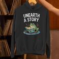Unearth a Story Frog Reading a Book Summer 2026 Unisex Hoodie