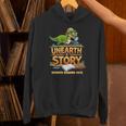 Women's Unearth a Story Dinosaur Reading Books Summer 2026 Unisex Hoodie