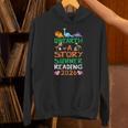 Women's Unearth A Story Summer Reading Program 2026 Dinosaur Book Unisex Hoodie